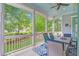 Relaxing screened-in porch with comfortable seating and a view of the landscaped backyard at 1776 W Canning Dr, Mount Pleasant, SC 29466