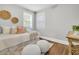 Bright bedroom with comfortable furnishings, natural light, and hardwood floors at 1790 Brockington Ave, Charleston, SC 29407