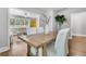 Charming dining room with a wooden table, seating for four, and view into the adjacent living room at 1790 Brockington Ave, Charleston, SC 29407