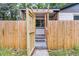 Home with a fenced front yard, covered porch, and an inviting entrance at 1790 Brockington Ave, Charleston, SC 29407