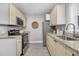 Modern kitchen with stainless steel appliances and granite countertops at 1790 Brockington Ave, Charleston, SC 29407