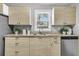Stylish kitchen with light wood cabinets, granite countertops, and stainless steel appliances and a window at 1790 Brockington Ave, Charleston, SC 29407