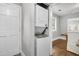 Convenient laundry area with stacked washer and dryer, and proximity to the dining room at 1790 Brockington Ave, Charleston, SC 29407