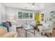Bright living room with hardwood floors, a modern sofa, and stylish decor at 1790 Brockington Ave, Charleston, SC 29407