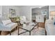 Elegant living area with a glass coffee table and stylish seating at 1790 Brockington Ave, Charleston, SC 29407