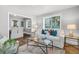 Cozy living room with stylish decor, featuring a comfortable sofa, decorative pillows, and hardwood flooring at 1790 Brockington Ave, Charleston, SC 29407