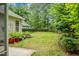 Well-maintained backyard featuring a green lawn, fence, and lush greenery perfect for outdoor enjoyment at 184 Angora Way, Summerville, SC 29485