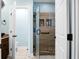 Modern bathroom features tiled shower with a glass door, and open door with toilet in the background at 184 Angora Way, Summerville, SC 29485
