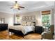 Spacious bedroom features tray ceilings, ceiling fan, large windows, and natural light at 184 Angora Way, Summerville, SC 29485