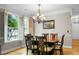Well lit dining room with views of the backyard through large windows at 184 Angora Way, Summerville, SC 29485