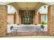 Inviting building entrance with brick columns, a covered entryway, and comfortable seating for guests at 184 Angora Way, Summerville, SC 29485
