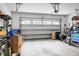 Spacious garage featuring an automatic door, overhead lighting and windows, and ample storage for vehicles and equipment at 184 Angora Way, Summerville, SC 29485