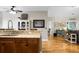 Open concept kitchen with granite countertops, wood floors, and breakfast bar area at 184 Angora Way, Summerville, SC 29485
