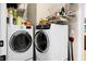 Well-equipped laundry room featuring a modern, front-load washer and dryer, with ample storage space at 184 Angora Way, Summerville, SC 29485