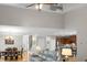 Open-concept living area featuring high ceilings, hardwood floors, dining area, and kitchen with stainless steel appliances at 184 Angora Way, Summerville, SC 29485