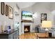 Cozy living room featuring a fireplace with a TV and comfortable seating at 184 Angora Way, Summerville, SC 29485