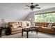 Comfortable living area with a spacious sectional sofa, ceiling fan, and large window for natural light at 184 Angora Way, Summerville, SC 29485