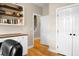 Office space featuring hardwood floors, built-in shelving, and a view into the hallway and staircase at 184 Angora Way, Summerville, SC 29485