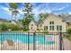 Community swimming pool with ample seating and views of the surrounding community homes at 184 Angora Way, Summerville, SC 29485