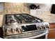 Granite countertops accent stainless steel gas cooktop with a modern look and high-end finishes at 184 Angora Way, Summerville, SC 29485