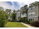 Well-maintained apartment building with lush landscaping, offering a comfortable living environment at 188 Midland Parkway # 110, Summerville, SC 29485