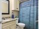 Bathroom featuring a granite countertop, vanity, and a blue patterned shower curtain and matching hand towel at 188 Midland Parkway # 110, Summerville, SC 29485