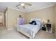 Bedroom with neutral carpet, light walls, a ceiling fan, and a neatly made bed with decorative pillows at 188 Midland Parkway # 110, Summerville, SC 29485