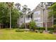 A well-maintained multi-story apartment building featuring lush landscaping and inviting walkways offers a beautiful exterior at 188 Midland Parkway # 110, Summerville, SC 29485