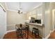 A cozy kitchen includes an eat-in bar, granite countertops, and stainless steel appliances for modern convenience at 188 Midland Parkway # 110, Summerville, SC 29485
