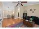 The open-concept living space features a dining area, hardwood floors, and neutral paint tones for a seamless flow at 188 Midland Parkway # 110, Summerville, SC 29485