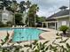 Community pool area with lounge chairs and umbrellas offering residents a space to relax and enjoy at 188 Midland Parkway # 110, Summerville, SC 29485