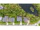 Aerial view of a neighborhood community with a lake view, manicured lawns, and beautiful trees at 1985 Shields Ln, Mount Pleasant, SC 29466