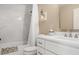 Bright bathroom with a white vanity, marble-look tiled shower, and decorative accents that complete the space at 1985 Shields Ln, Mount Pleasant, SC 29466