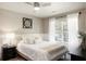 Inviting bedroom featuring a comfortable bed with a ceiling fan and decor at 1985 Shields Ln, Mount Pleasant, SC 29466