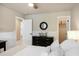 Bedroom featuring a black dresser, round mirror, and an open closet with neutral paint and white trim at 1985 Shields Ln, Mount Pleasant, SC 29466