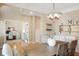 Bright dining room with hardwood floors, modern chandelier, and an adjacent office space at 1985 Shields Ln, Mount Pleasant, SC 29466
