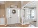 Bright foyer with a welcoming wreath on the front door and stylish decor at 1985 Shields Ln, Mount Pleasant, SC 29466
