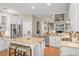 Open-concept kitchen with island seating, stainless steel appliances, and granite countertops at 1985 Shields Ln, Mount Pleasant, SC 29466