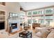 Cozy living room with fireplace, built-in shelves, and bright windows at 1985 Shields Ln, Mount Pleasant, SC 29466