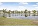 Pond view of community houses and palm trees on sunny day at 1985 Shields Ln, Mount Pleasant, SC 29466