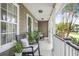 Cozy porch with rocking chairs, plants, and views of the surrounding greenery, perfect for relaxing at 1985 Shields Ln, Mount Pleasant, SC 29466