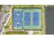 Aerial shot of blue and green tennis and basketball courts near pond in community at 1985 Shields Ln, Mount Pleasant, SC 29466