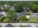 Aerial view of a home showcasing its landscaped yard and neighborhood setting at 2017 Woodland Shores Rd, Charleston, SC 29412