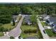 An aerial view showcasing a home with lush green landscaping and neighborhood streets at 2017 Woodland Shores Rd, Charleston, SC 29412