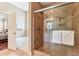 Beautiful bathroom featuring a glass shower and a luxurious soaking tub at 2017 Woodland Shores Rd, Charleston, SC 29412