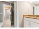 Bathroom with granite countertops, white cabinets, toilet and a partial view of the hall at 2017 Woodland Shores Rd, Charleston, SC 29412