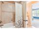 Well-maintained bathroom with a shower, and a partial view of the bedroom area at 2017 Woodland Shores Rd, Charleston, SC 29412