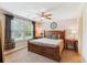 Inviting bedroom boasts a ceiling fan, natural light, and comfortable furniture at 2017 Woodland Shores Rd, Charleston, SC 29412