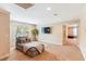 Comfortable bonus room with a plush chaise lounge, a wall-mounted TV, and natural light at 2017 Woodland Shores Rd, Charleston, SC 29412