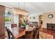 This dining room has a large chandelier over a wood table and chairs at 2017 Woodland Shores Rd, Charleston, SC 29412